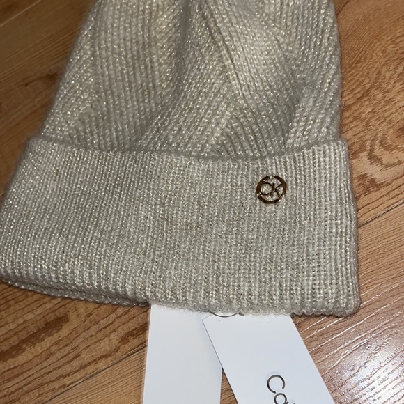 CALVIN KLEIN Cream with Sparkle Highlights Gold Logo Badge Pom Beanie MSRP $48 - Picture 2 of 4